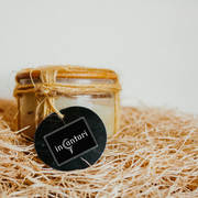 Body massage butter called Bare Body in a 4 oz glass jar 